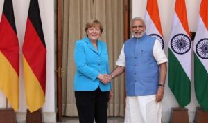 German Chancellor Merkel shakes hands with India’s Prime Minister Modi during a photo opportunity ahead of their meeting at Hyderabad House in New Delhi